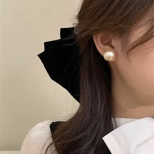 Elegant French style large pearl stud earrings for a chic and minimalist jewelry look