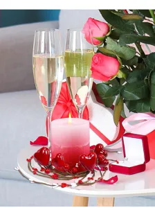 Valentine's Day heart berry candle wreath decoration on a romantic dinner table