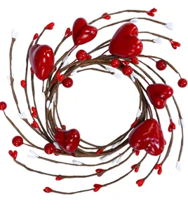 Close-up detail of artificial red heart and berry candle wreath for Valentine's Day decor