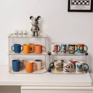 Clear acrylic tiered cup storage rack for desktop organization and kitchen counter
