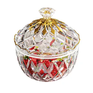 Elegant clear PET candy jar featuring a faceted design and a luxury golden lid handle