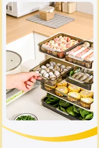 Detailed view of pulling out a transparent tray from a multi-layer kitchen prep rack