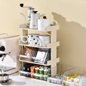 4-tier cream countertop organizer for coffee capsules, tea bags, and mugs in kitchen.