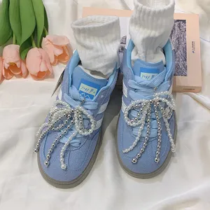 Elegant pearl bow shoe charms for sneakers, adding a stylish touch to footwear decoration