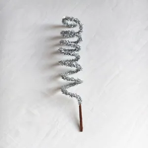 Detail shot of a silver glitter spiral Christmas pick decoration with tinsel finish