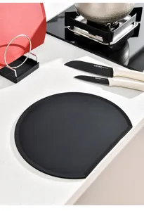 Detailed view of a premium black D-shaped semicircular cutting board on a kitchen counter