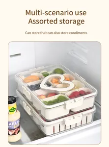 Divided refrigerator food storage box with fruit in a stackable design