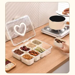 Detailed view of an 8-compartment seasoning box with transparent lid and heart handle