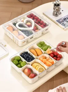 Close-up of a divided fruit storage box with eight compartments and a sealed lid