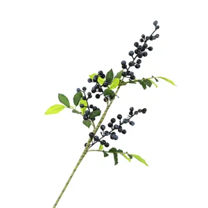 Realistic artificial dark blue berry branch with green leaves for home and Christmas decor