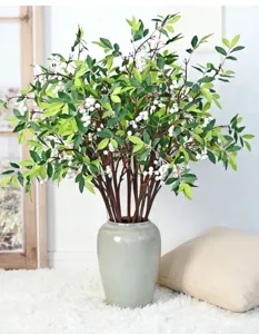 Lifelike artificial Nandina domestica berries in a ceramic vase for elegant home decor