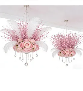 Detailed view of pink glitter berry stems and rose floral chandelier decoration