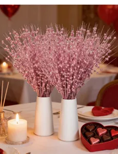 Detailed view of pink glitter berry stems in white vases for Valentine's Day table decor