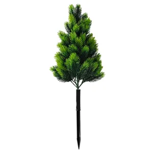 Close-up view of a realistic artificial pine garden stake for outdoor lawn decoration