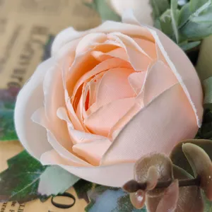 Detailed macro view of a soft peach artificial rose petal for elegant table decor
