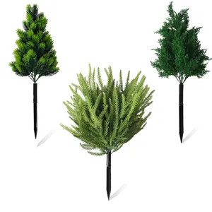 Detailed view of three styles of artificial green plant stakes for garden decoration