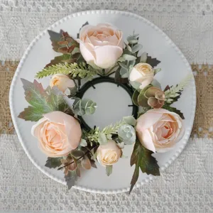 Elegant close-up of artificial rose and maple leaf wreath for table decoration