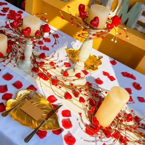 Set of 4 red heart berry candle rings on a romantic tablescape for Valentine's Day.