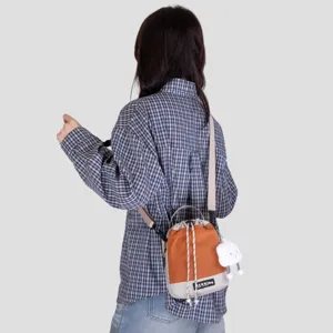 Trendy canvas bucket crossbody bag with cute cloud pendant, casual daily water bottle bag.