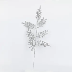 Silver glitter artificial plant detail shot, perfect for Christmas home decor and props.