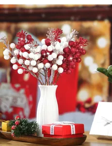 Artificial red and white glitter berry branches for Christmas and New Year home decoration.