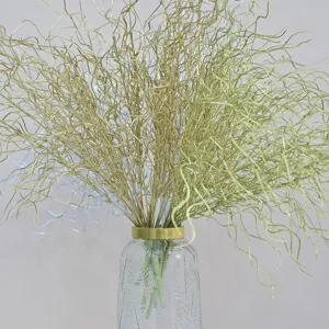 Close-up of 53cm golden curly dragon beard grass branches in a textured glass vase