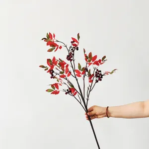 Detailed close-up view of artificial Nandina berry branch for wedding and home decor
