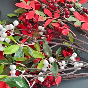 Close-up detail of artificial Nandina berry branches with red and white berries
