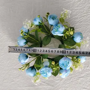Detailed view of blue rose and babysbreath wreath measured at approximately 26cm diameter