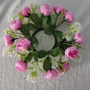 Artificial pink tea rose and baby's breath candle ring wreath for table party decoration detail