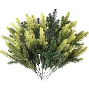 Detail of lush artificial pine needles in varied green tones for festive DIY wreaths.