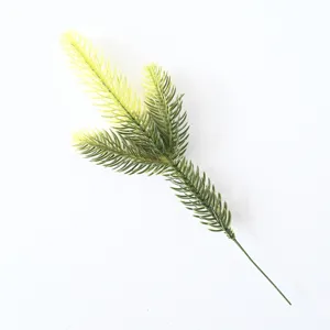 Close-up of artificial green pine branch for DIY Christmas wreaths and home decor