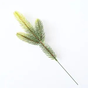 Macro detail of a green artificial pine branch for DIY Christmas wreath decorations
