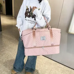 Pink quilted travel duffel bag detail, multi-functional portable foldable luggage bag for fitness trips.