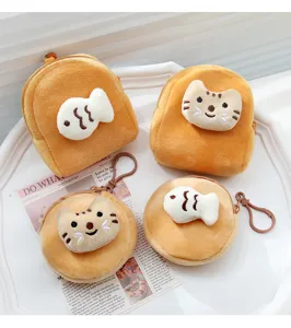 Detailed view of cute plush coin purses with cat and fish designs for coins and earphones.
