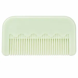 Mini pettine per capelli in plastica verde chiaro portatile con design a onde unico.