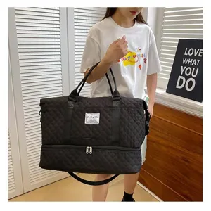 Large capacity black quilted travel duffel bag, portable overnight gym and luggage bag for women.