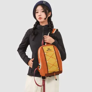 Detail of a yellow and orange outdoor backpack with reflective strips for hiking and running.