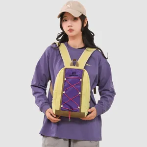 Female model carrying a yellow and purple outdoor sports backpack with red bungee cords