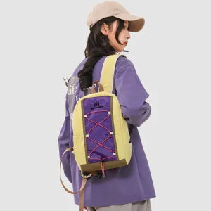 Detailed view of lightweight hiking backpack worn by a female model in outdoor scene