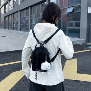 Trendy mini backpack with cute cloud pendant, versatile casual shoulder bag for daily outings.