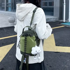 Stylish casual mini backpack with grid front pocket and cute cloud pendant for daily use.