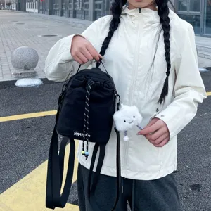 Casual black mini drawstring backpack featuring cute plush cloud pendant, versatile daily use.