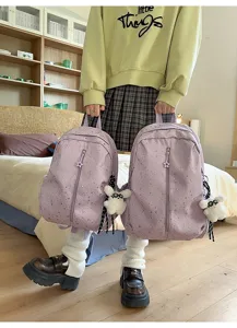 Mochila escolar morada de moda con estampado de estrellas y lindo colgante de peluche