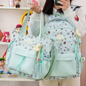 Joli ensemble sac à dos et sac bandoulière vert menthe style japonais avec motif d'étoiles.