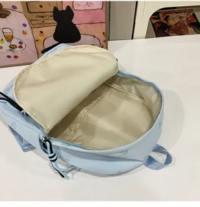 Detailed view of the light blue casual backpack interior, showing spacious capacity and lining.