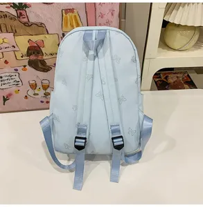 Light blue casual backpack with cute butterfly patterns, spacious and stylish for students.