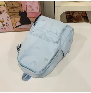 Light blue casual backpack with cute butterfly pattern, large capacity school bag for daily use.