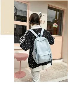 Light blue casual backpack with cute butterfly pattern, perfect for daily school and travel use.