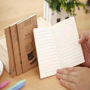 Detailed view of portable kraft paper notebooks showing lined inner pages and cover illustrations.